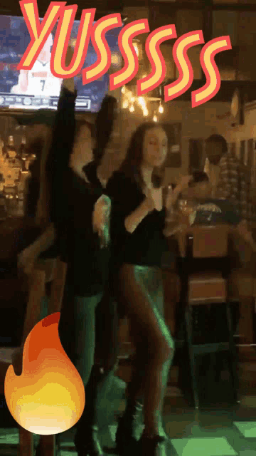 a group of people are dancing in a bar and the word yussss is visible