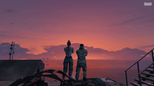 a man and a woman are standing on a rock overlooking a body of water