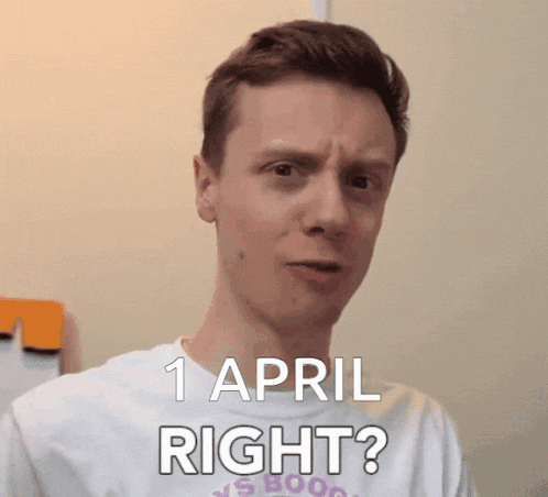 a man is wearing a white shirt that says 1 april right on it