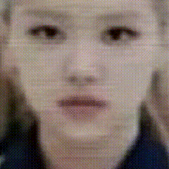 a close up of a woman 's face with a blurry background .