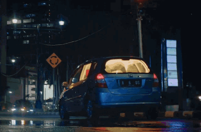 a blue car with a license plate that says a6 us