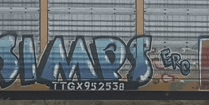 graffiti on the side of a train car that says ttgx9525588