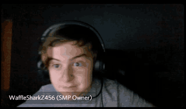 a young boy wearing headphones with the name wafflesharkz456