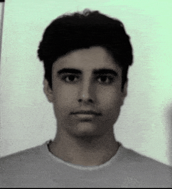 a black and white photo of a young man in a white shirt