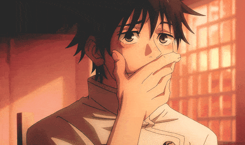 a close up of a person covering their mouth with their hands