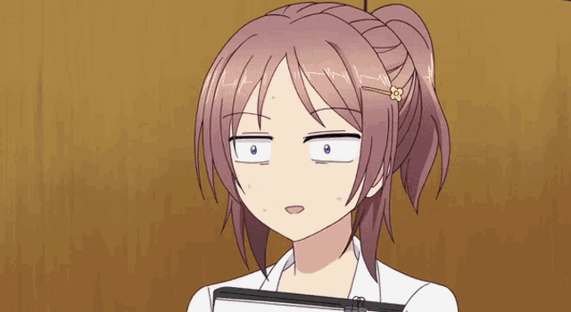 a girl with purple hair and a yellow flower in her hair is making a funny face