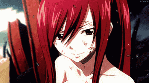 a close up of a girl with red hair and black eyes