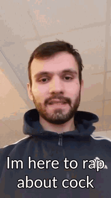 a man with a beard is wearing a hoodie and says i 'm here to rap about cock .