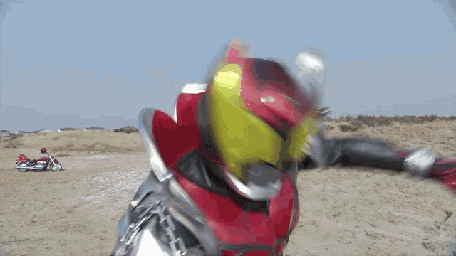a blurred image of a superhero in a red and silver suit