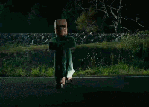 a car is driving down a road at night