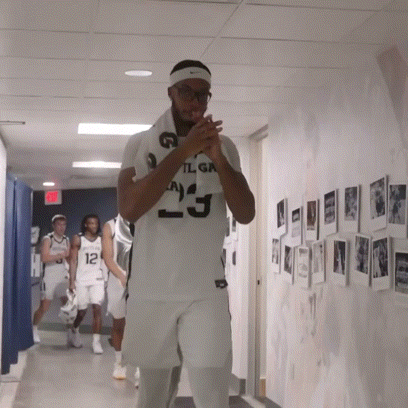 a basketball player wearing a white jersey with the number 23 on it