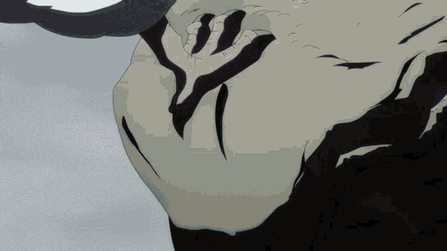 a close up of a person 's face with a black and white design