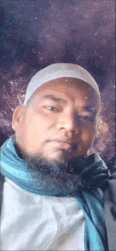 a man with a beard is wearing a white hat and scarf .