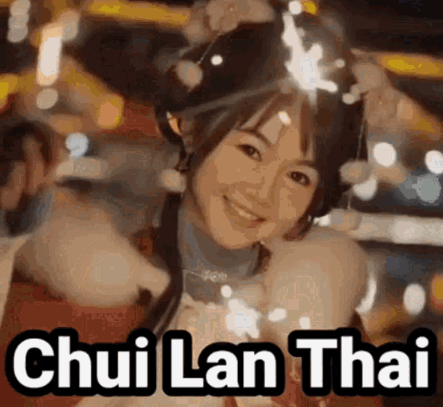 a woman is smiling and holding sparklers in front of her head and the words chui lan thai are above her head .