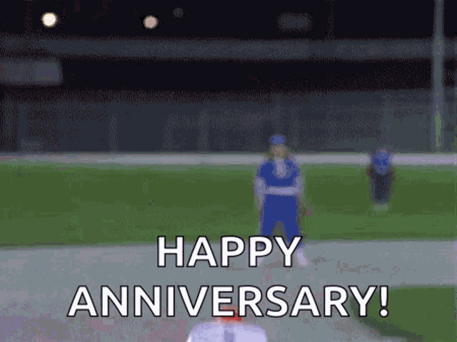 a blurred image of a baseball field with the words `` happy anniversary '' written on it