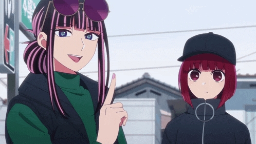 two anime girls are standing next to each other and one is pointing up