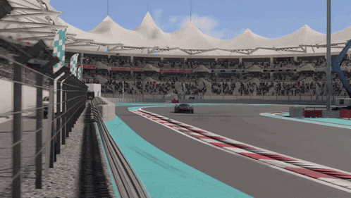 a race car is driving down a track with a checkered flag on the side
