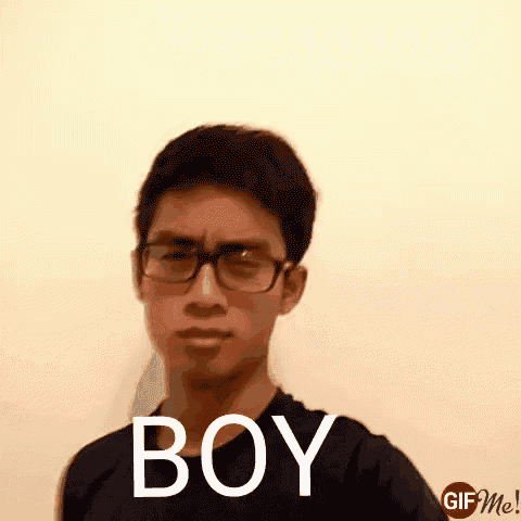 a man wearing glasses and a black shirt with the word boy written on it