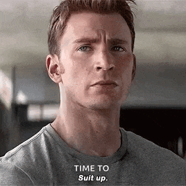 a close up of a man 's face with the words `` time to suit up . ''