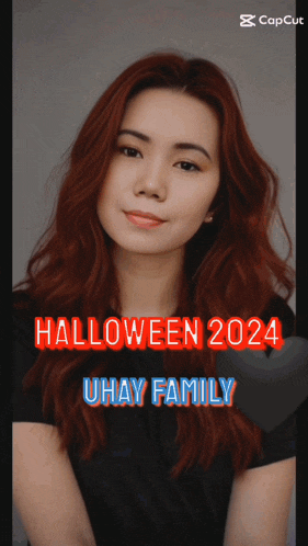 a woman with red hair and the words halloween 2024 uhay family on the bottom