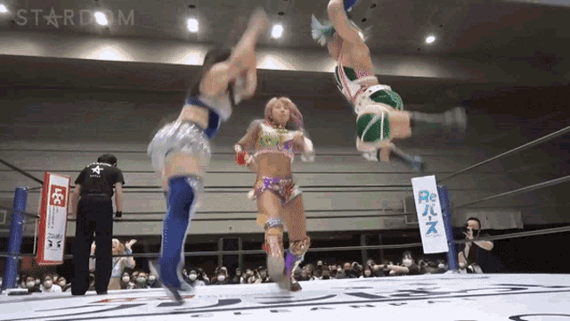 a woman in a wrestling ring with a sign that says ' stardom ' on it