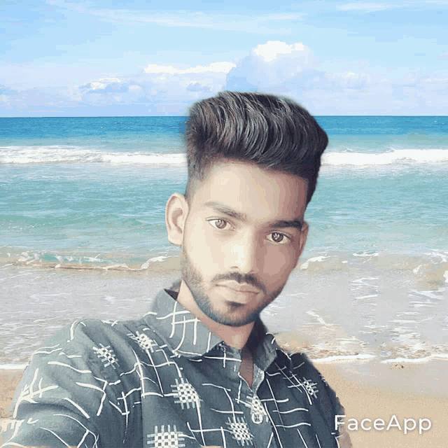 a man taking a selfie on a beach with faceapp written on the bottom right