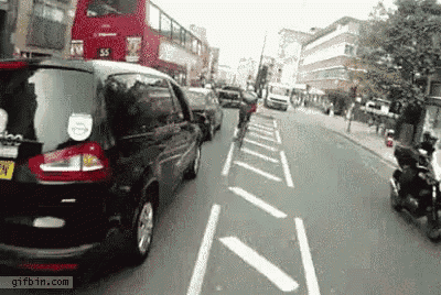 Cyclist Gets Squeezed Between Bus And Truck GIF - Bus Close Call Cyclist GIFs