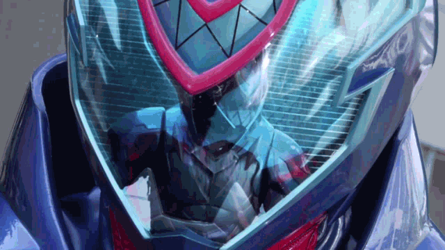 a close up of a person wearing a helmet with a red and blue design