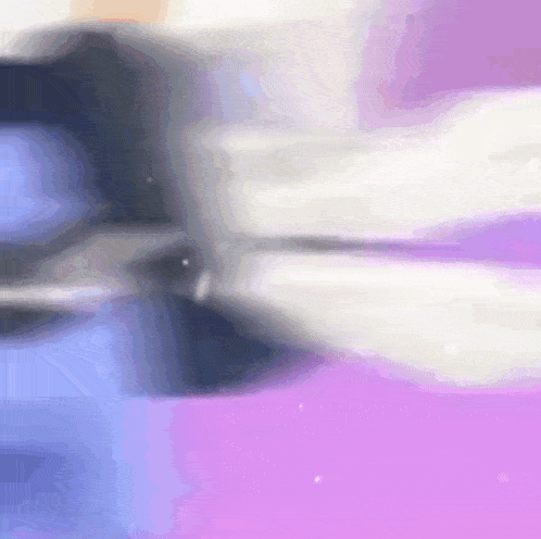 a blurry picture of a person 's face on a pink and blue background