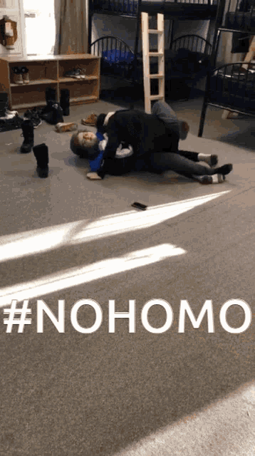 two people laying on the floor with the hashtag #nohomo on the bottom