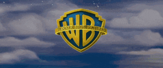 the logo for warner bros. pictures is shown on a cloudy sky