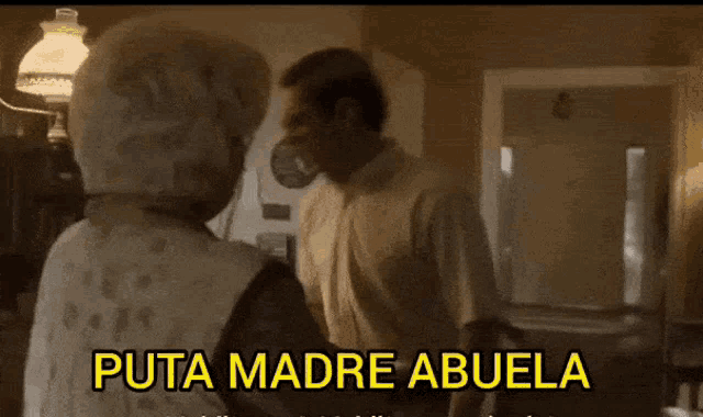 a man and a woman are standing next to each other with the words puta madre abuela written above them