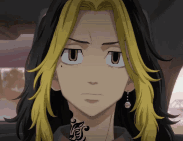 a close up of a person 's face with yellow hair