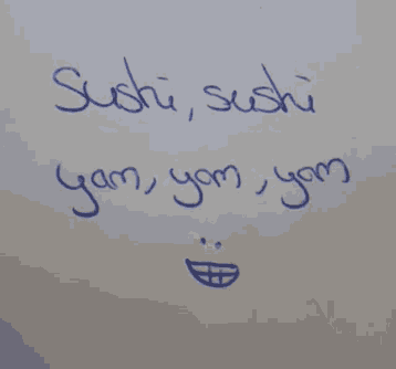 someone has written the word sushi on a white surface