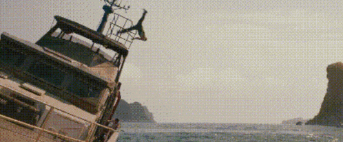 a boat that has fallen over in the ocean