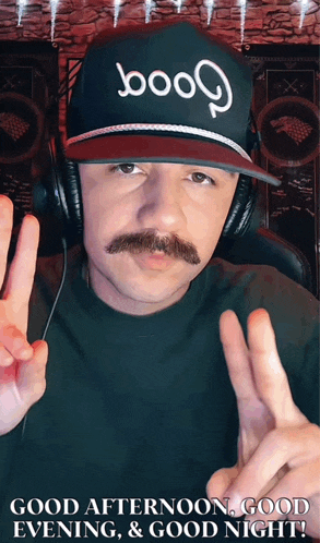 a man with a mustache wearing a hat that says booo on it