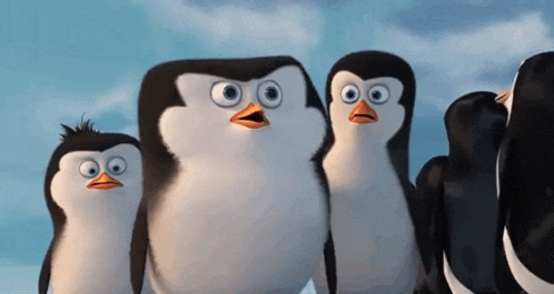 a group of penguins from madagascar are standing next to each other .