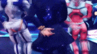 a blurry picture of a person standing next to a robot in a video game .