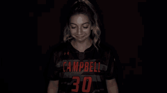 a woman wearing a black shirt with campbells written on it