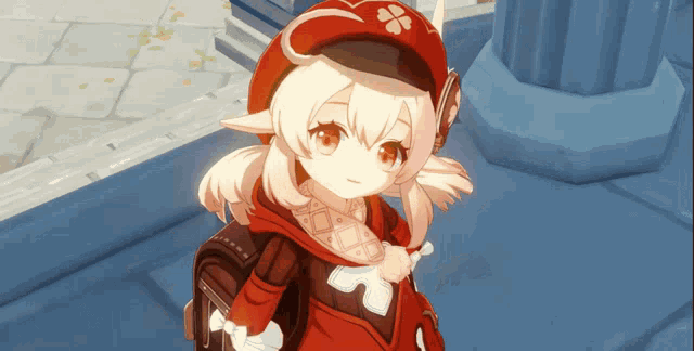 a girl in a red hat with a clover on it is wearing a backpack