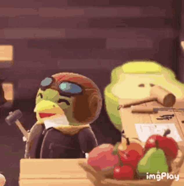 a cartoon bird wearing a helmet and goggles is sitting at a table with fruit .