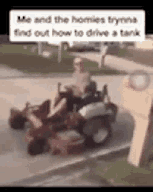 a man is driving a lawn mower down a sidewalk .