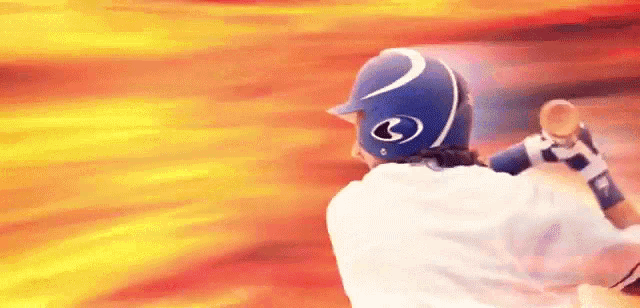 a baseball player in a blue helmet is swinging a bat