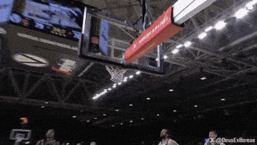 a basketball game is being played in a stadium with a sign that says turkish airlines on it