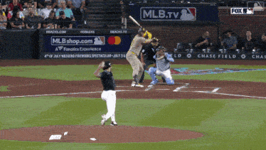 a baseball game is being played in front of a mlb.tv sign