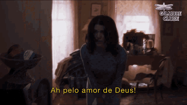 a woman in a room with the words ah pelo amor de deus on the bottom
