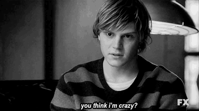 a young man in a striped sweater is asking if he is crazy