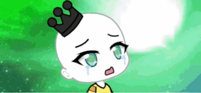 a cartoon character with a crown on his head is crying and has blue eyes .
