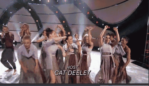 a group of dancers on a stage with the name cat deeley on the bottom