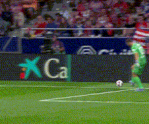 a soccer player kicks a ball on a field with a sign that says ca on it